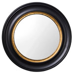 A round wall mirror with a bold black and brass-coloured frame, reflective surface in the center.