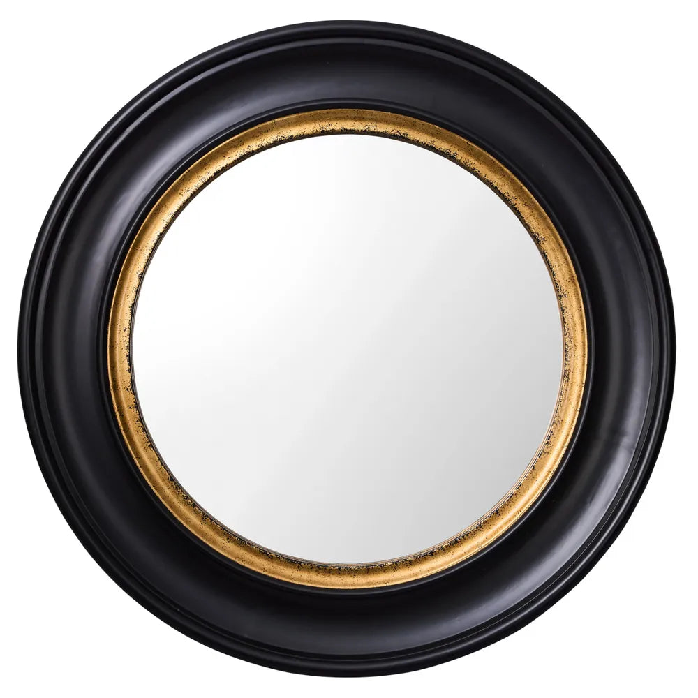 A round wall mirror with a bold black and brass-coloured frame, reflective surface in the center.