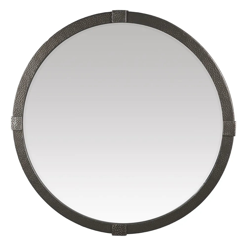Round mirror with textured bronze iron frame on a white background
