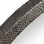 Close-up of a textured metal frame on a white background