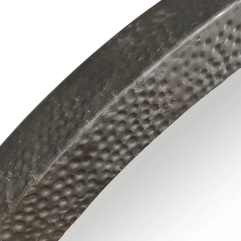 Close-up of a textured metal frame on a white background