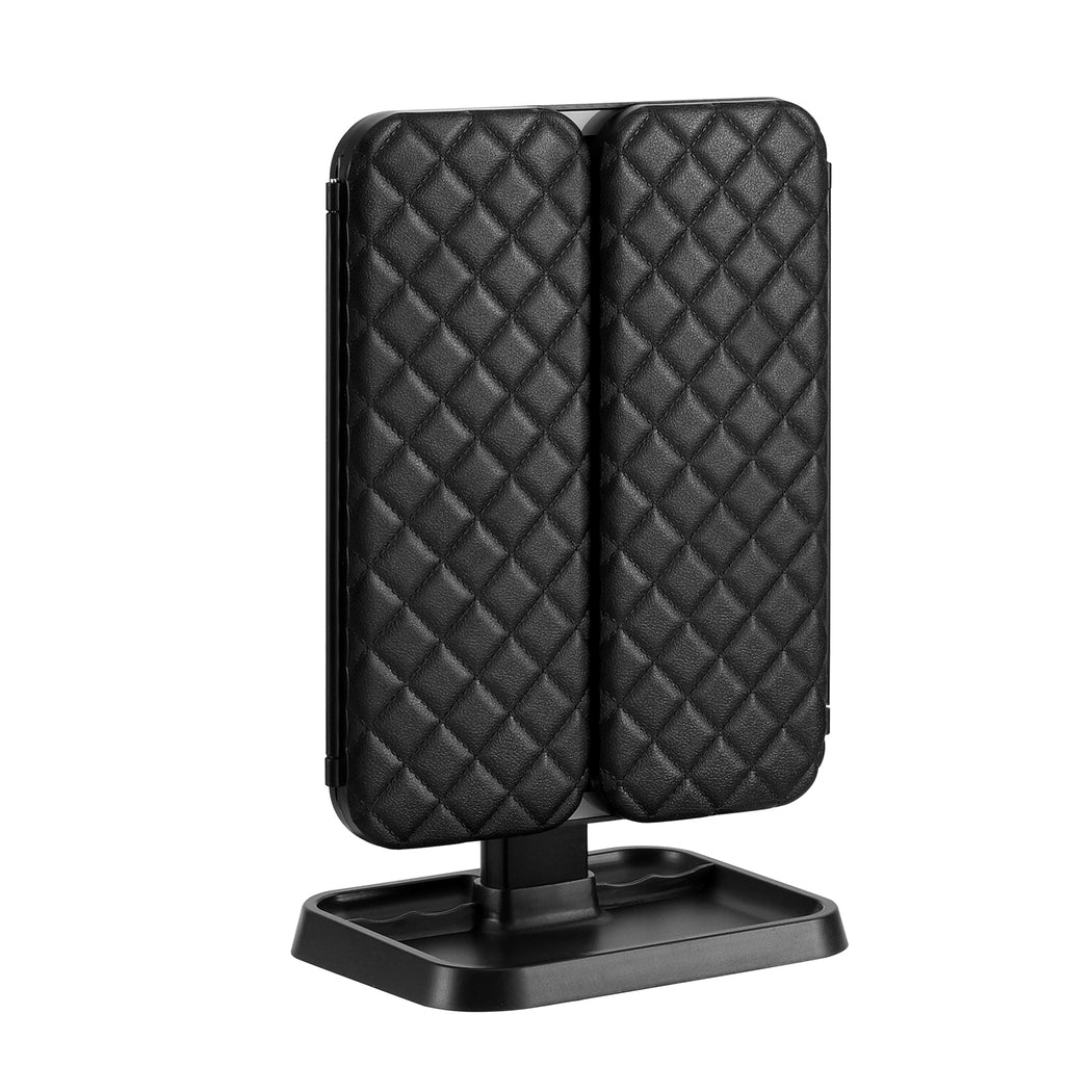 Black quilted phone stand on a white background