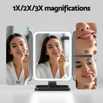 Makeup mirror with 1X, 2X, and 3X magnifications showing a woman applying lipstick.