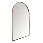 Arched mirror with bronze frame on a white background