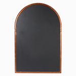 Arched mirror with a brown frame on a white background