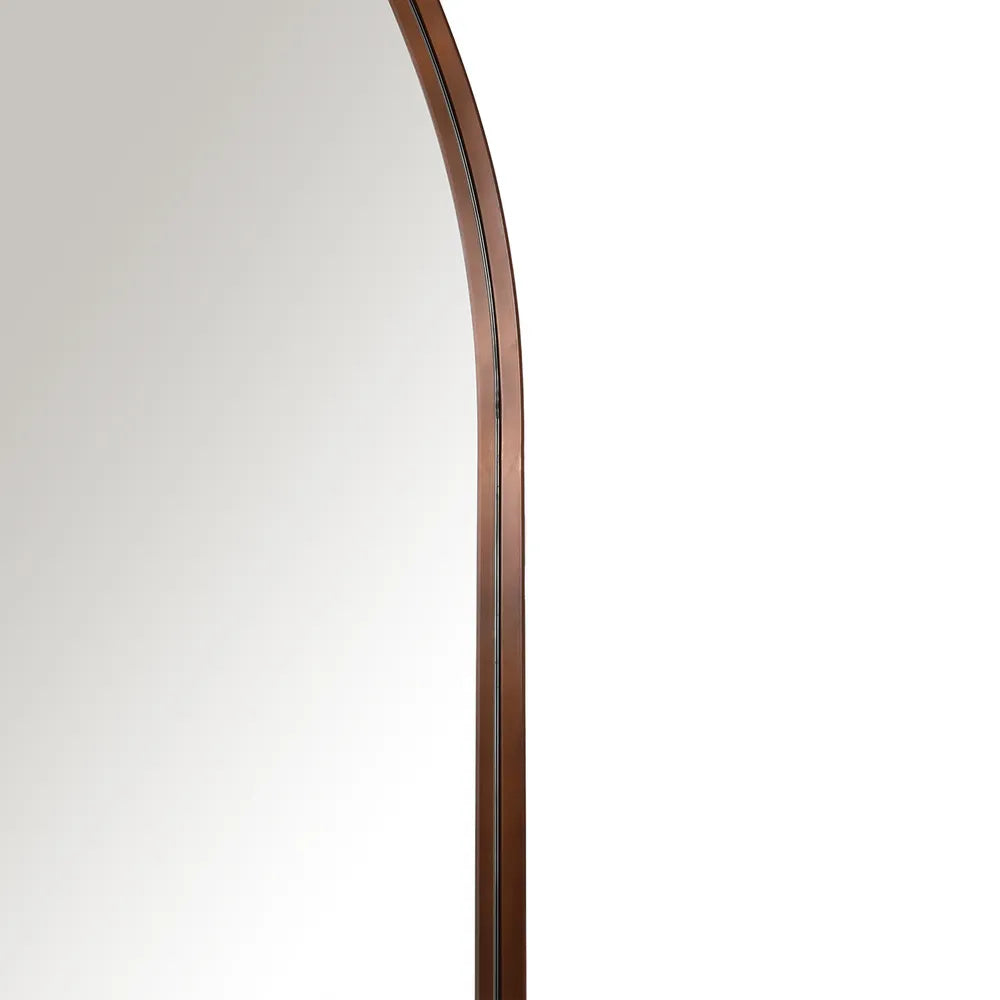 Curved mirror with a wooden frame on a white background